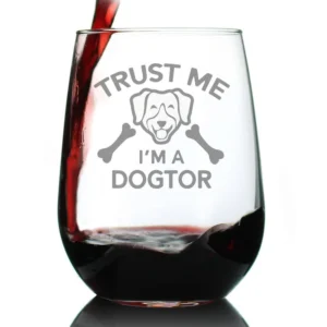 Wine glass with humorous dog-themed text.